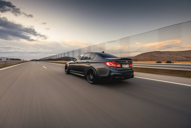 BMW M5 rear view on the road with Covar wheels